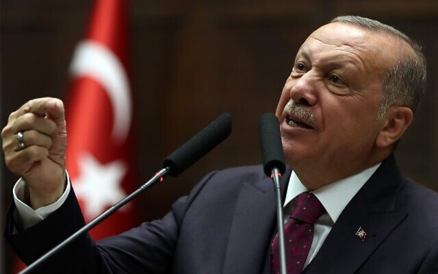 President of Turkey and leader of Turkey's ruling Justice and Development (AK) Party Recep Tayyip Erdogan gestures as he delivers a speech during his party's parliamentary group meeting at the Grand National Assembly of Turkey (TBMM) in Ankara, on October 30, 2019. (Photo by Adem ALTAN / AFP)