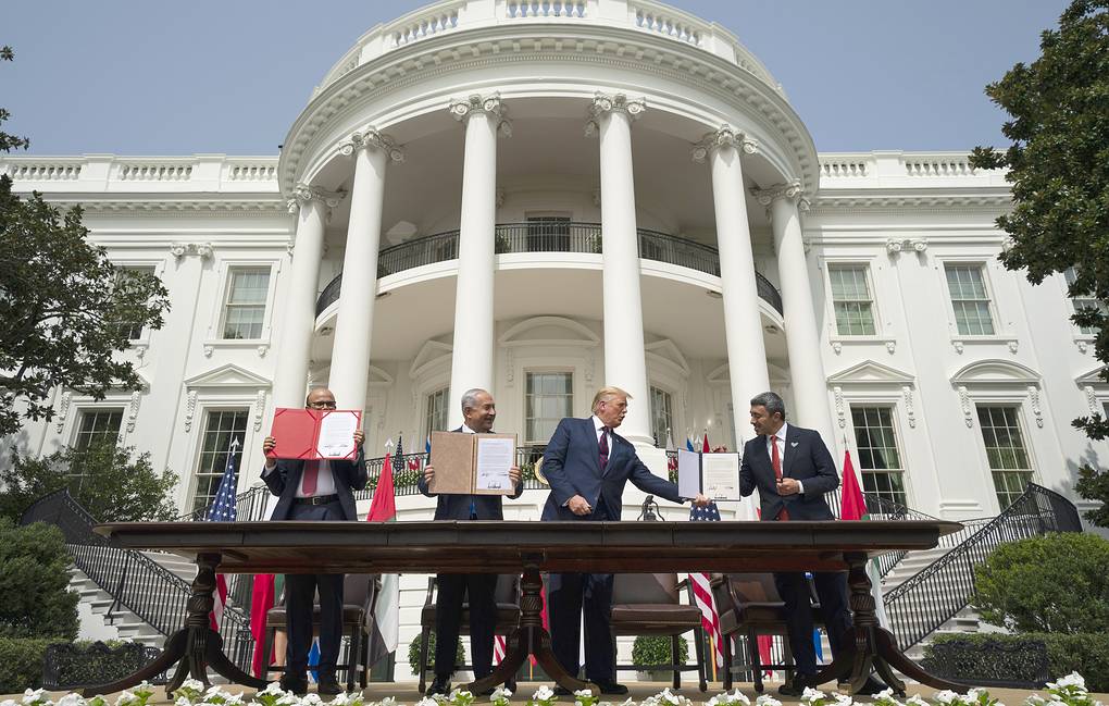 President Donald Trump, center, with from left, Bahrain Foreign Minister Khalid bin Ahmed Al Khalifa, Israeli Prime Minister Benjamin Netanyahu, and United Arab Emirates Foreign Minister Abdullah bin Zayed al-Nahyan, during the Abraham Accords signing ceremony on the South Lawn of the White House, Tuesday, Sept. 15, 2020, in Washington. (AP Photo/Alex Brandon)