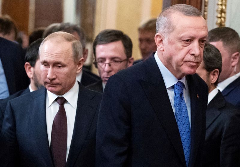 FILE PHOTO: Russian President Vladimir Putin and Turkish President Tayyip Erdogan arrive for a news conference following their talks in Moscow, Russia March 5, 2020. Pavel Golovkin/Pool via REUTERS//File Photo