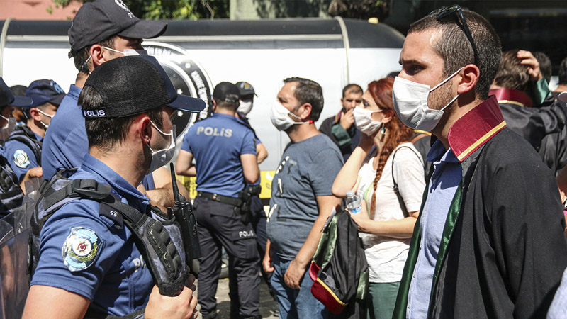 Policeman block protesting lawyers during a demonstration against a government draft bill on changing the system of bar associations on July 10, 2020, in Ankara, Turkey. Turkey's ruling party on June 30 presented a bill to parliament on changing the system of bar associations that opponents say will dent lawyers' independence and influence. (Photo by Tunahan Turhan / INA Photo Agency / Sipa USA)(Sipa via AP Images)