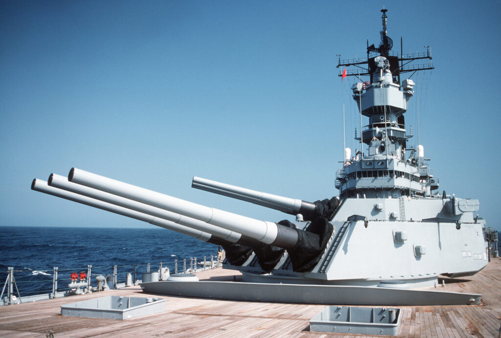 The No. 1 and No. 2 Mark 7 16-inch/50-caliber gun turrets are trained to starboard during the main battery gunnery exercise aboard the battleship USS IOWA (BB 61).