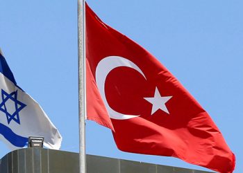 A Turkish flag flutters atop the Turkish embassy as an Israeli flag is seen nearby, in Tel Aviv, Israel June 26, 2016. Picture taken June 26, 2016. REUTERS/Baz Ratner