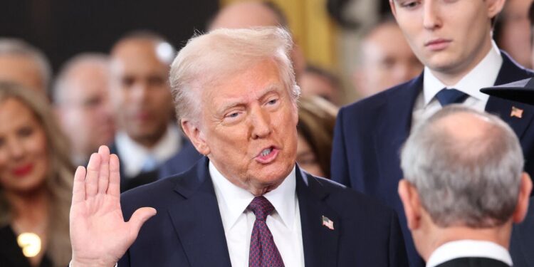 Donald Trump is sworn in as US president in the Rotunda of the US Capitol in Washington, on January 20, 2025. Trump takes office for his second non-consecutive term as the 47th president of the United States. (Photo by Kevin Lamarque / POOL / AFP)