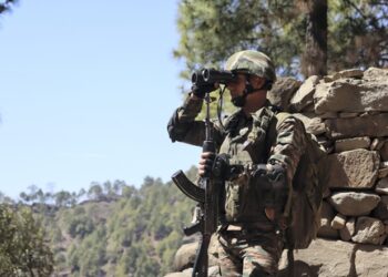 Poonch: An army jawan keeps vigil at LoC in Poonch, Saturday, March 22, 2025. (PTI Photo)  (PTI03_22_2025_000157A) *** Local Caption ***