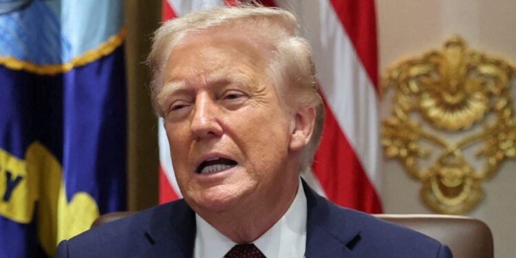U.S. President Donald Trump reacts during a cabinet meeting at the White House in Washington, D.C., U.S., August 26, 2025. REUTERS/Jonathan Ernst