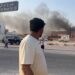 This frame grab taken from an AFPTV footage shows a man looking at smoke billowing after explosions in Qatar's capital Doha on September 9, 2025. An Israeli military official told AFP that the military had carried out air strikes on Doha on September 9 in an operation targeting senior leaders of Palestinian militant group Hamas. (Photo by Jacqueline PENNEY / AFPTV / AFP) (Photo by JACQUELINE PENNEY/AFPTV/AFP via Getty Images)