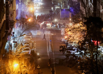 Iranian demonstrators gather in a street during a protest over the collapse of the currency's value, in Tehran, Iran, January 8, 2026. Stringer/WANA (West Asia News Agency) via REUTERS ATTENTION EDITORS - THIS PICTURE WAS PROVIDED BY A THIRD PARTY TPX IMAGES OF THE DAY