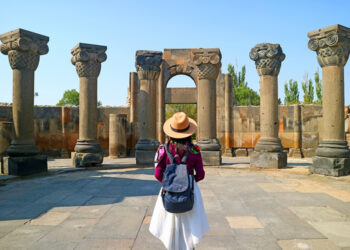Female Traveler Visiting the Zvartnots Cathedral, UNESCO World Heritage Site in Armavir Province of Armenia