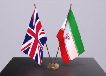 Iran and UK flag. Politics concept, partner deal beetween countries. Partnership agreement of governments 3D illustration.