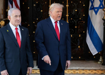 U.S. President Donald Trump speaks next to Israeli Prime Minister Benjamin Netanyahu upon arrival for meetings at Trump's Mar-a-Lago club in Palm Beach, Florida, U.S., December 29, 2025. REUTERS/Jonathan Ernst