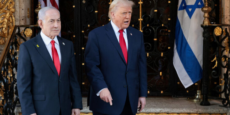U.S. President Donald Trump speaks next to Israeli Prime Minister Benjamin Netanyahu upon arrival for meetings at Trump's Mar-a-Lago club in Palm Beach, Florida, U.S., December 29, 2025. REUTERS/Jonathan Ernst