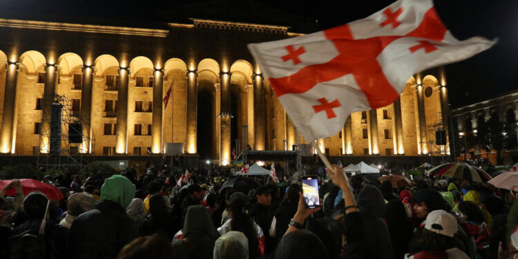 Demonstrators hold a rally to protest against a bill on "foreign agents", near Georgian Parliament building, in Tbilisi, Georgia, May 13, 2024. REUTERS/Irakli Gedenidze